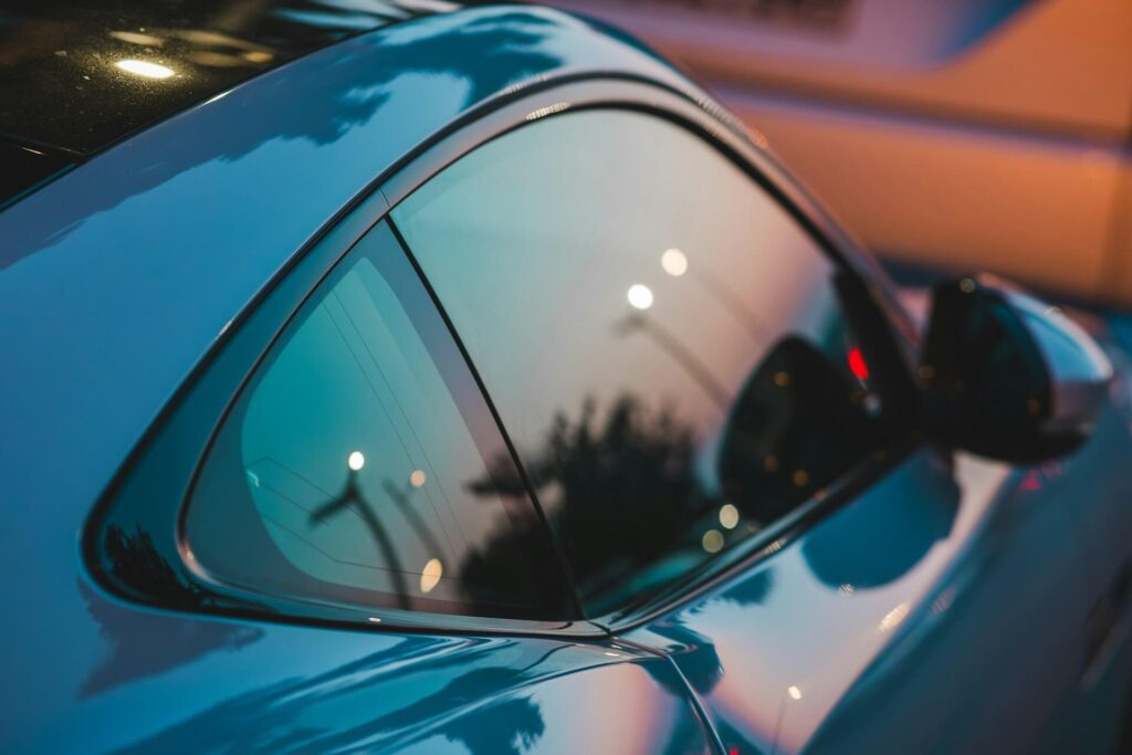 Blue Car Facing sunset with window tint