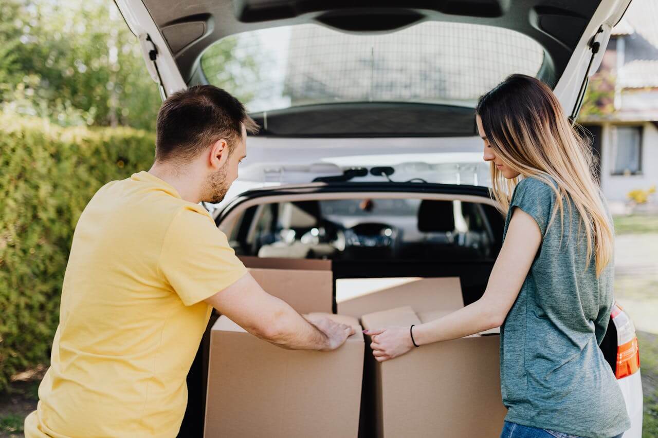 photo of a couple decluttering their vehicle